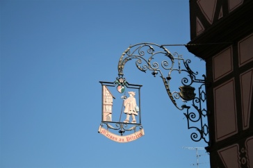 Sign hanging from the Maison au Pelerin in Colmar, Alsace
