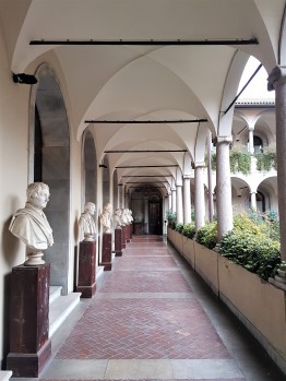 Statues line the balcony at the Pinacoteca Ambrosiana in Milan