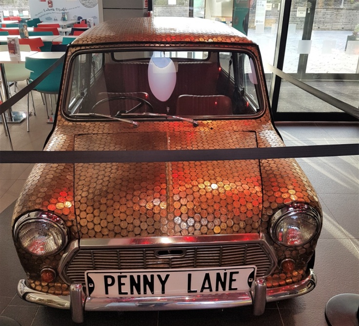A mini covered in pennies at The Royal Mint Experience