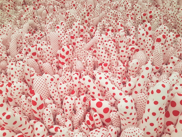 Red and white spotted fabric shapes in Yayoi Kusama's Infinity Mirror Room at the Fondation Louis Vuitton museum and cultural centre in Paris